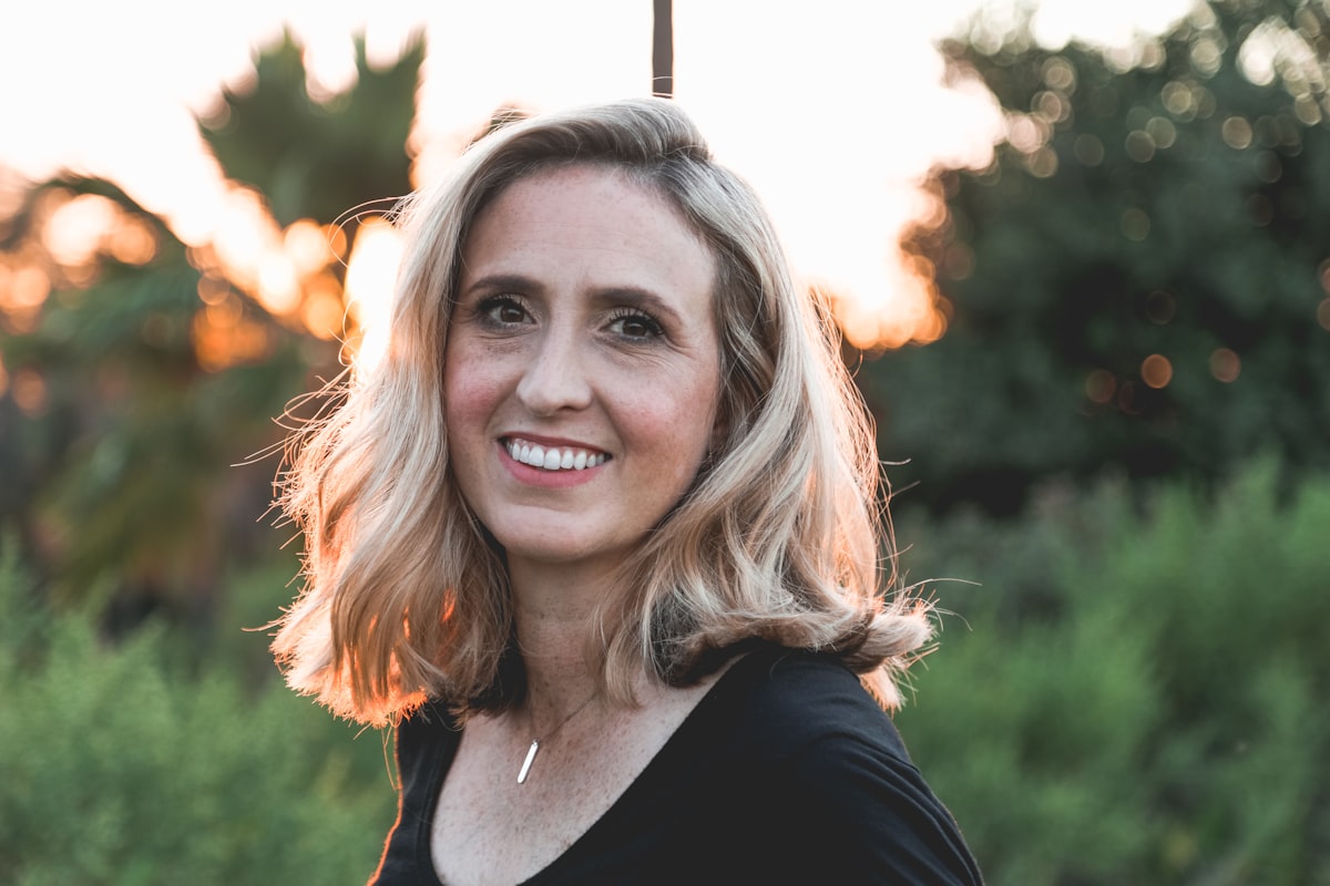 Portrait of a smiling woman in warm outdoor light